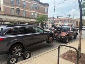 AWD Subaru Outback being towed after overheating near Addison and Southport in Wrigleyville Chicago