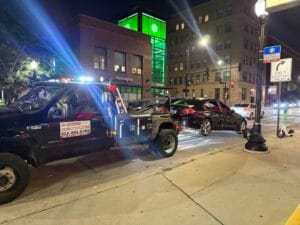 BMW sedan being towed after shutting off and failing to restart near Southport and Fullerton in Chicago