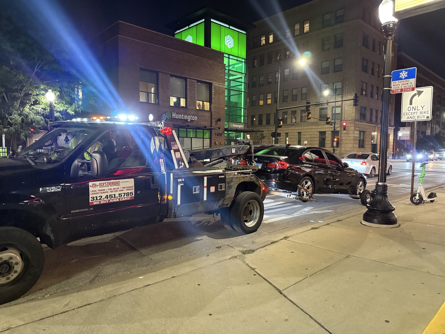 BMW sedan being towed after shutting off and failing to restart near Southport and Fullerton in Chicago