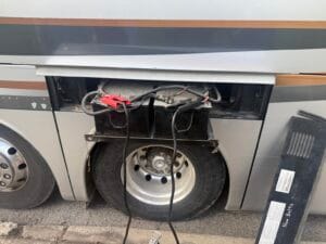 Coach bus battery system connected for an emergency jump start near Graceland Cemetery in Chicago