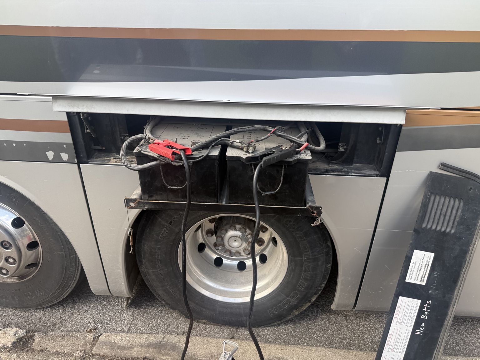 Coach bus battery system connected for an emergency jump start near Graceland Cemetery in Chicago