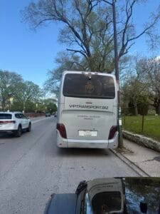 Coach bus receiving an emergency commercial jump start near Clark Street and Irving Park Road by Graceland Cemetery in Chicago