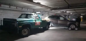 Bmw wheel lift and dollies in parking garage.