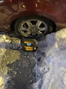Nighttime tire inflation in snow.