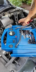 Portable jump starter and battery connections.