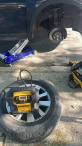 Removed wheel floor jack and tire inflator.