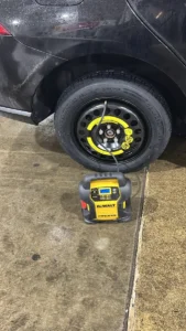 Temporary spare wheel with portable inflator.