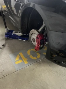Vehicle wheel removed in parking garage.