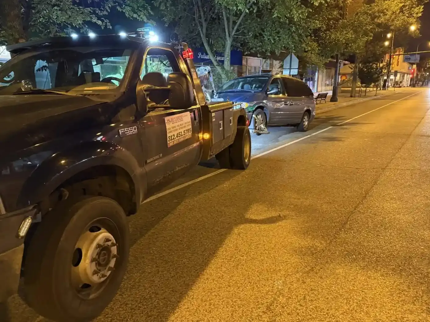 Rick’s wheel-lift truck on a Chicago North Side street at night